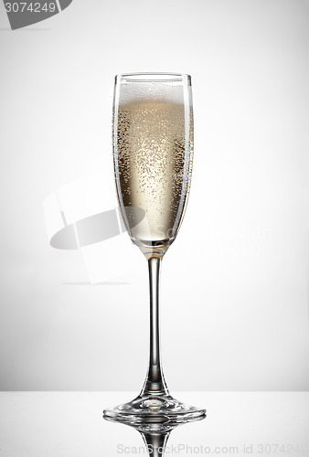 Image of champagne in glass isolated on white