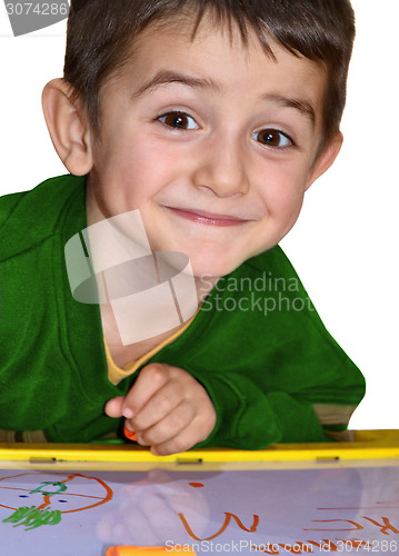 Image of Young boy write