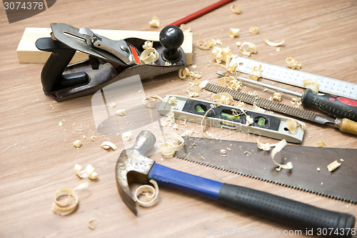 Image of Carpentry Tools And Wood Shavings On Floor