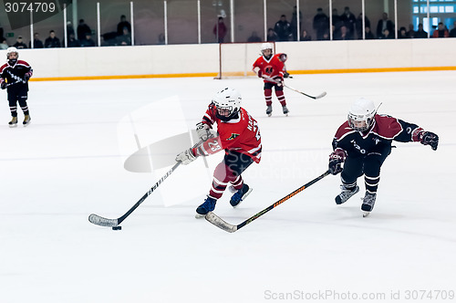 Image of Game of children ice-hockey teams