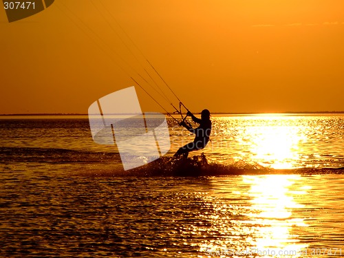 Image of Silhouette of a kitesurf on a gulf on a sunset 2