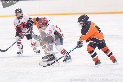 Image of Game of children ice-hockey teams