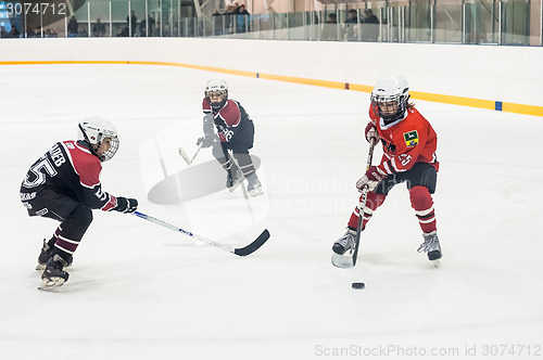 Image of Game of children ice-hockey teams