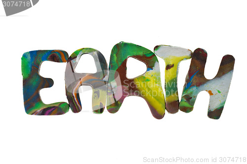 Image of Plasticine letters forming word Earth written on white background