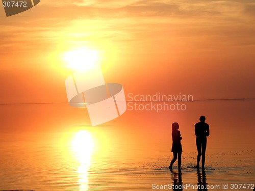 Image of A black silhouette of a children on a sunset