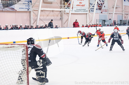Image of Attack in game between children ice-hockey teams