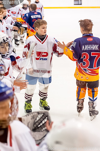 Image of Child hockey. Greeting of players after game