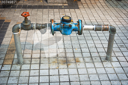 Image of Main Water Line with Meter and Valve on Public Sidewalk
