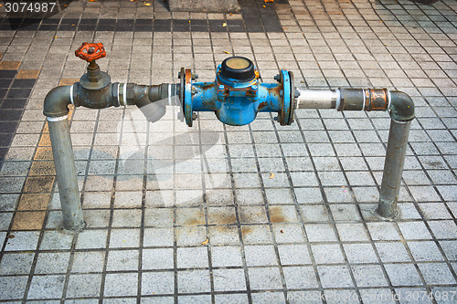 Image of Main Water Line with Meter and Valve on Public Sidewalk