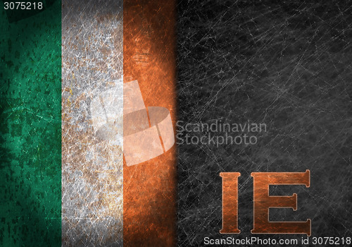 Image of Old rusty metal sign with a flag and country abbreviation