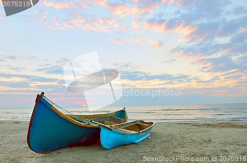 Image of two Fishing boats and sunrise 