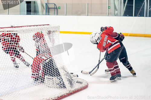 Image of Gate attack in game of children ice-hockey teams