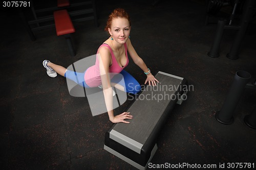 Image of young girl do tretching