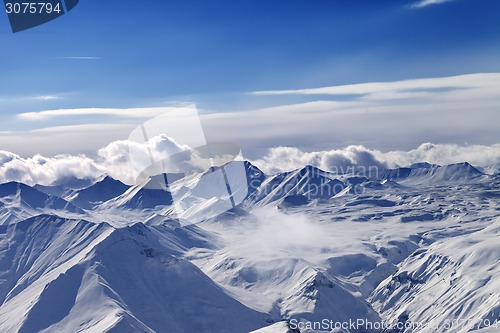 Image of Snow plateau and sunlight sky with clouds in evening
