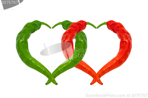 Image of Red and green chili peppers in love