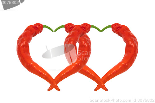 Image of Two hearts composed of red chili peppers