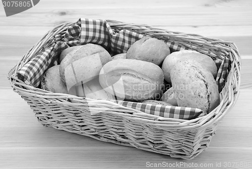 Image of Basket full of fresh bread rolls