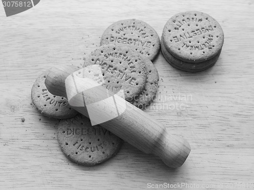 Image of Starting to crush digestive biscuits with a rolling pin