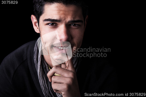 Image of Young Man Portrait on Black