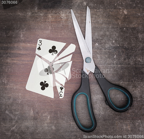 Image of Concept of addiction, card with scissors