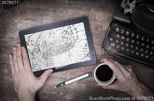 Image of Tablet computer with broken glass