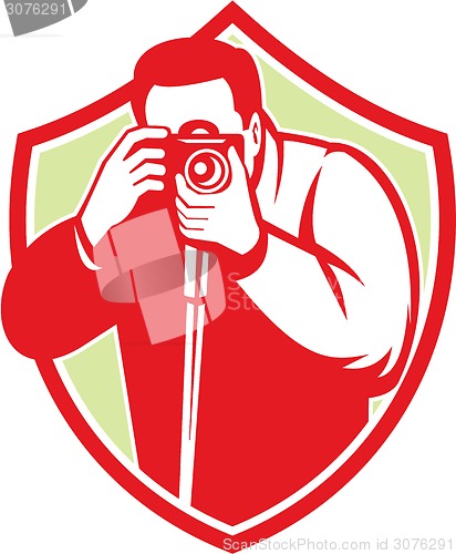 Image of Photographer Shooting Camera Shield Retro