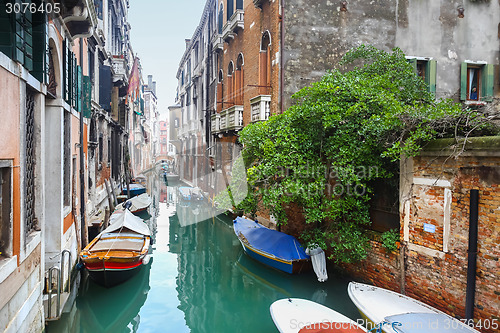 Image of Empty gondolas parked in water canal