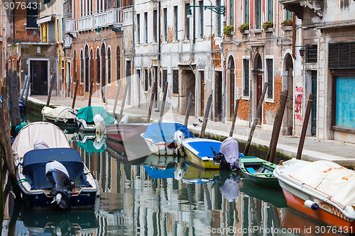 Image of Gondolas moored along water channel