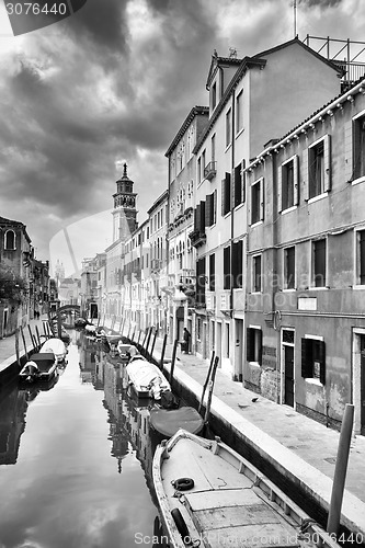 Image of Gondolas moored in water canal bw