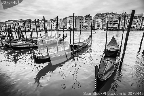 Image of Gondola moored at dock in Venice