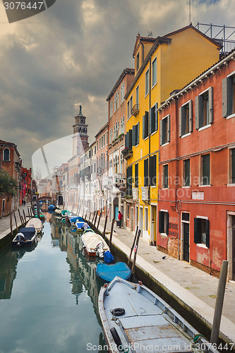 Image of Gondolas moored in water canal