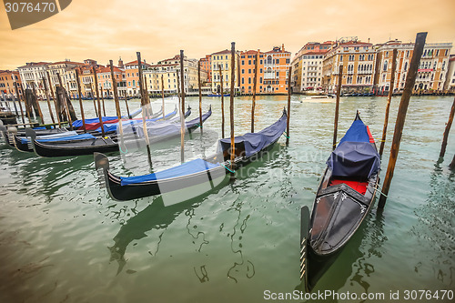 Image of Gondolas moored at dock in Venice