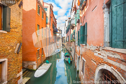 Image of Gondolas parked next to buildings in Venice