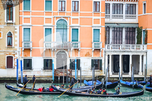 Image of Gondolas with tourists in Venice