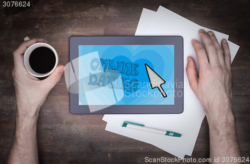 Image of Online dating on a tablet