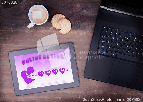 Image of Online dating on a tablet