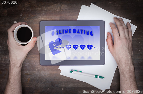 Image of Online dating on a tablet