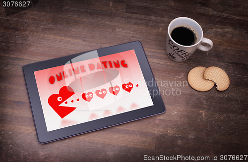 Image of Online dating on a tablet