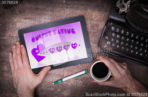 Image of Online dating on a tablet