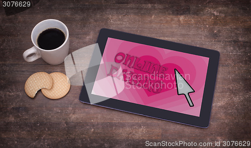 Image of Online dating on a tablet