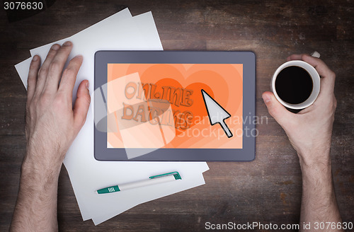 Image of Online dating on a tablet