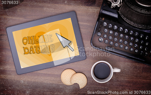 Image of Online dating on a tablet