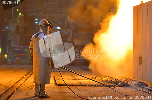 Image of Smelting furnace and worker