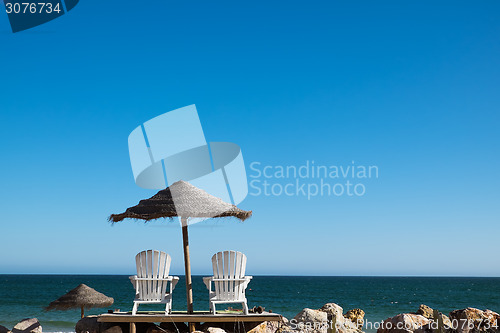 Image of Two Chairs at the Beach