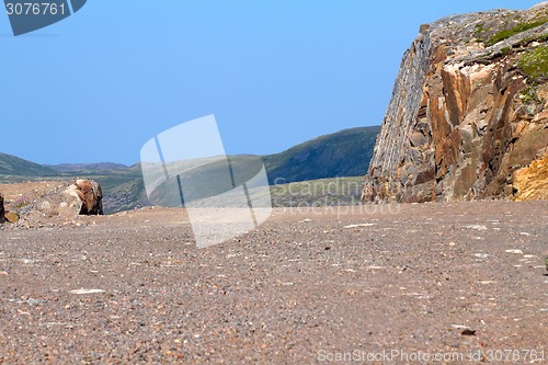 Image of road construction in rocks of mountains