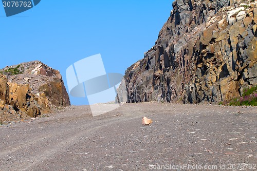 Image of road construction in rocks of mountains