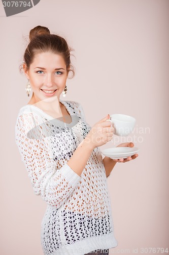 Image of Woman with cup and saucer