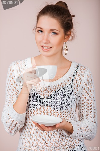 Image of Woman with cup and saucer