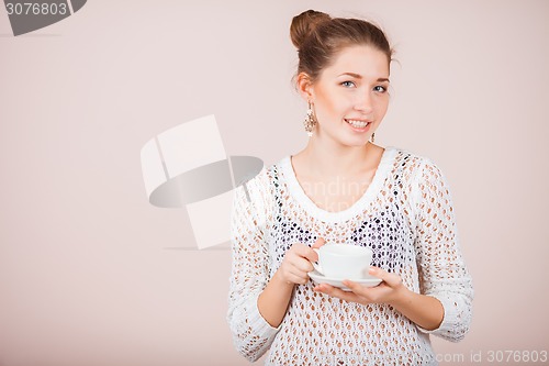 Image of Woman with cup and saucer