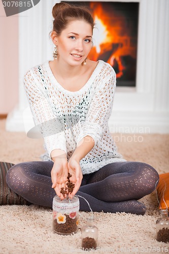 Image of Lady and coffee beans